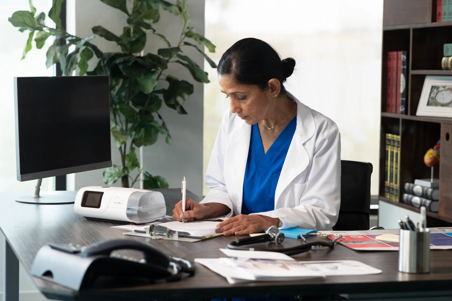 Female doctor doing a thing with her notes