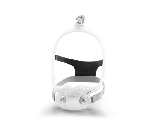 A white and black DreamWear full face CPAP mask with magnetic clips and a quiet venting system.