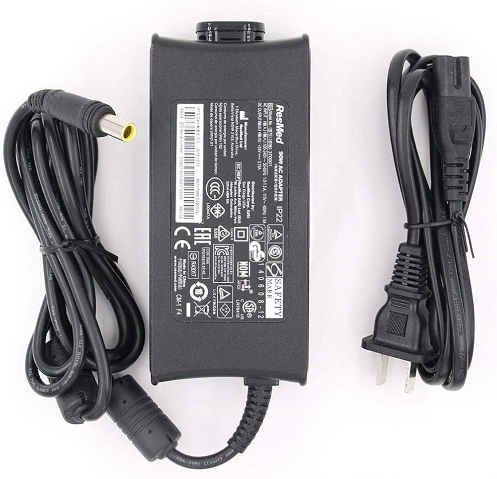 A black ResMed AirSense 10 Power Supply with attached power cable and label.