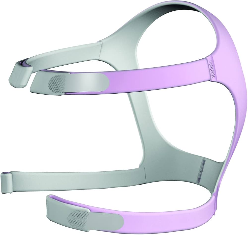 A purple and gray ResMed Mirage FX nasal CPAP mask headgear designed for her, with adjustable straps and a soft fabric structure.