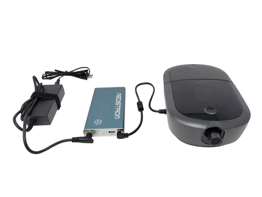 The Pilot 12 Lite CPAP Travel Battery connected to a CPAP Mahine