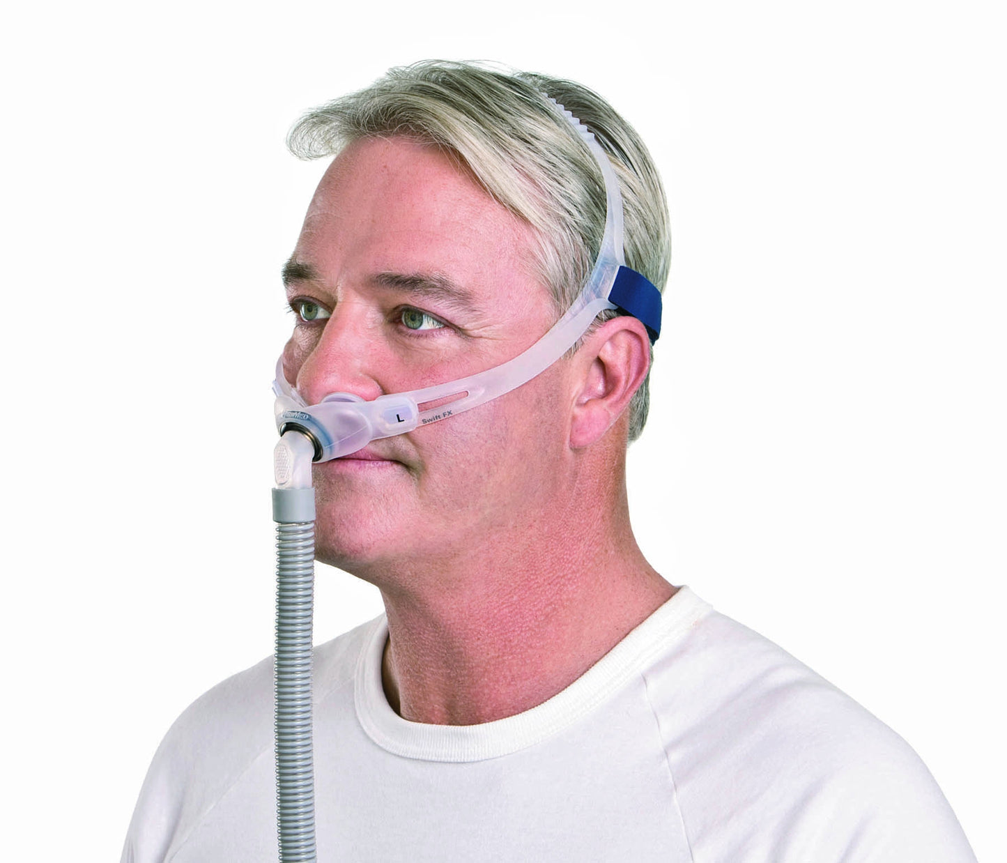 A man comfortably wearing the Swift FX Nasal Pillow CPAP Mask