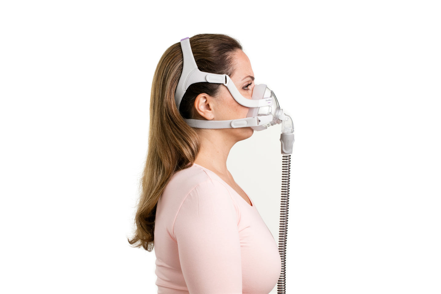 The side view of a woman wearing the ResMed Airfit F20 For Her Full Face CPAP Mask
