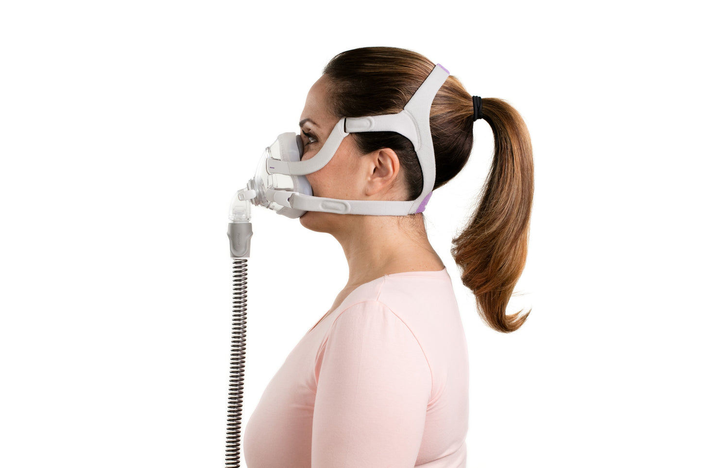 A woman wearing the ResMed AirTouch F20 Full Face CPAP Mask For Her