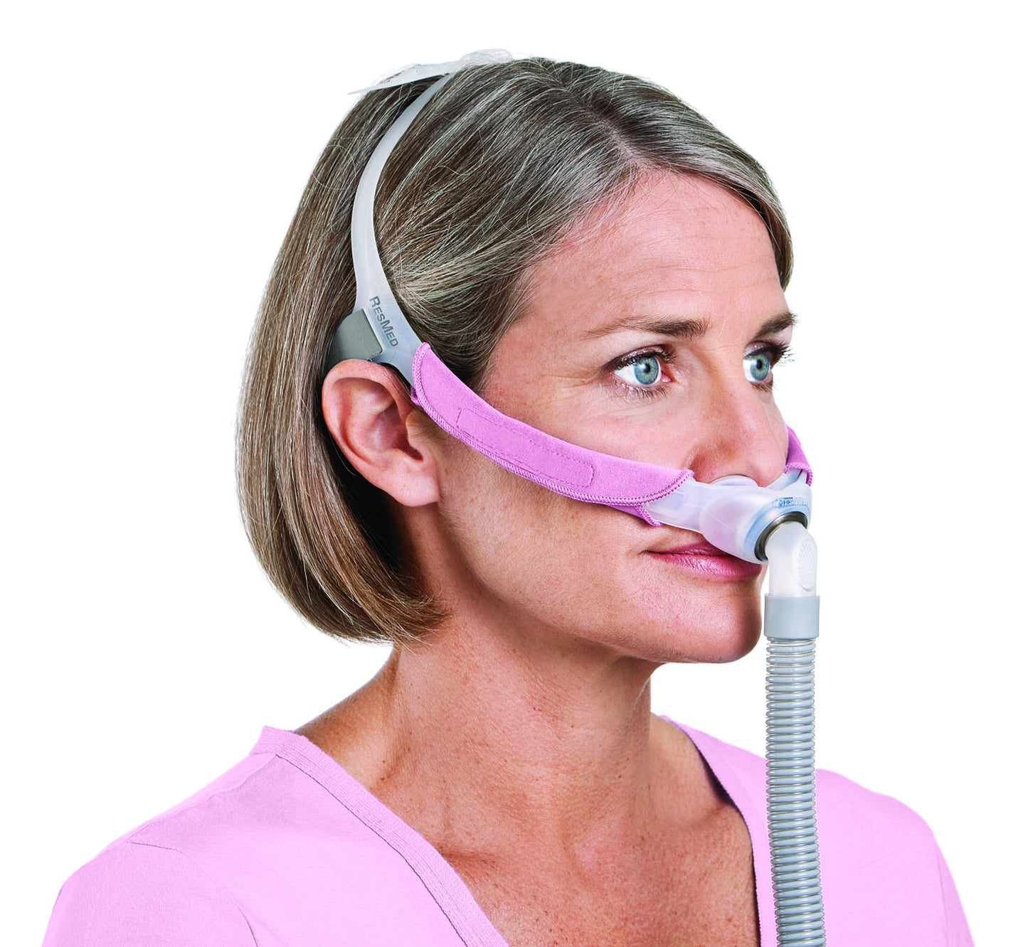 a woman wearing the Swift FX For Her Nasal Pillow CPAP Mask