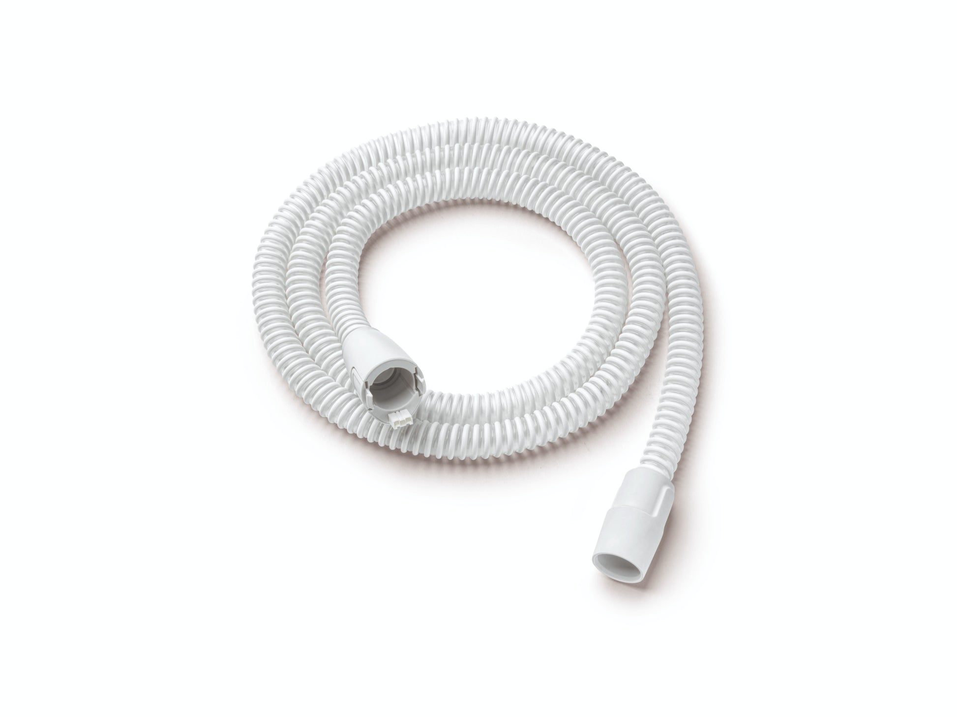 A coiled, white heated tubing designed for use with DreamStation 1 and 2 by Philips Respironics, featuring connectors at both ends.