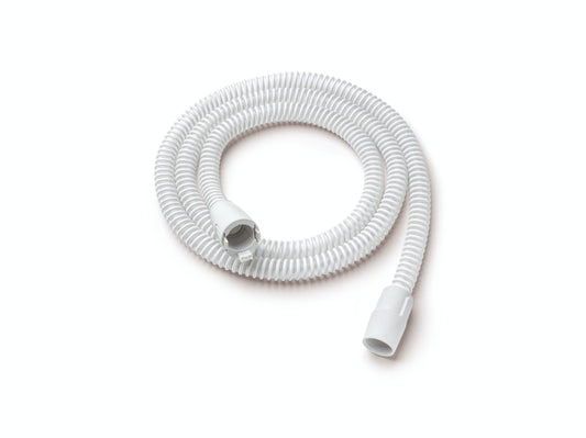 A coiled, white heated tubing designed for use with DreamStation 1 and 2 by Philips Respironics, featuring connectors at both ends.