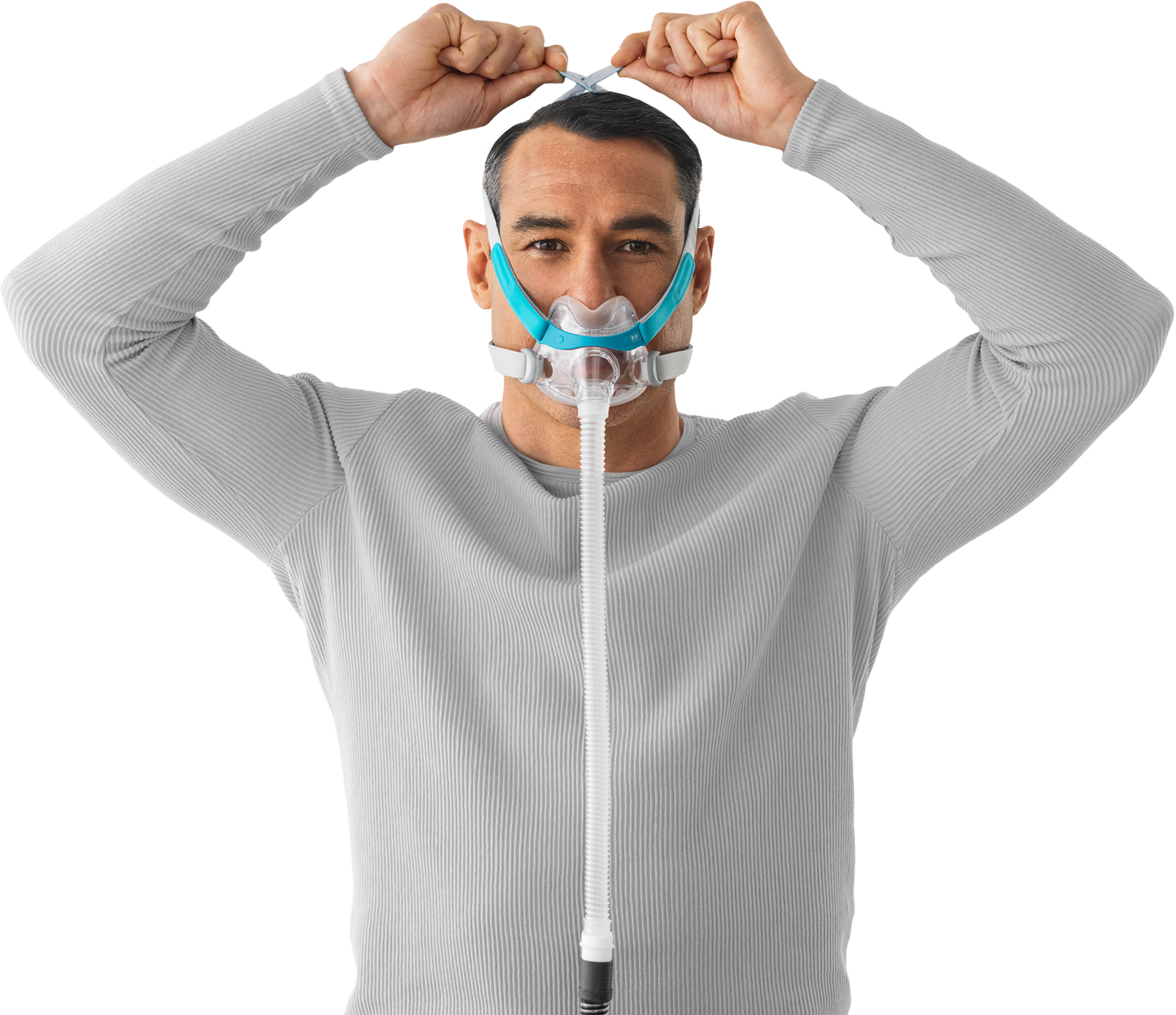 A man putting on the Evora Full Face CPAP Mask