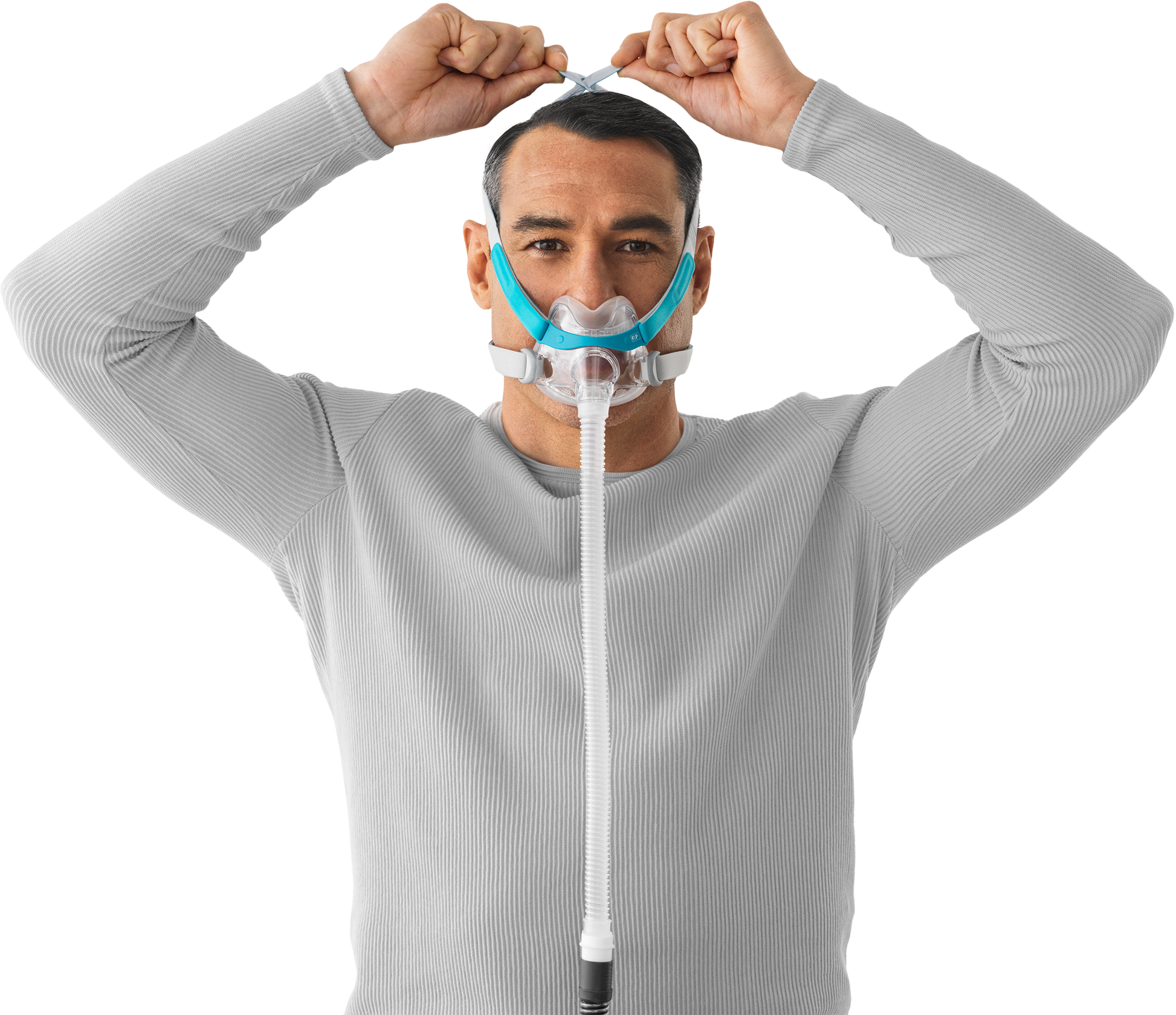 A man putting on the Evora Full Face CPAP Mask