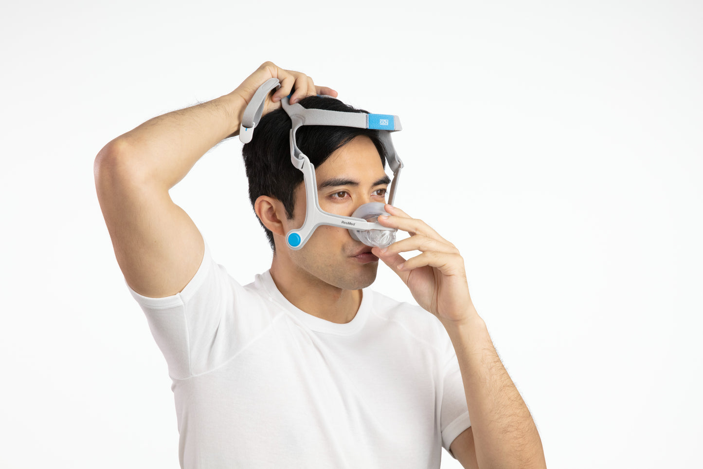 A man fitting the AirTouch N20 Nasal CPAP Mask