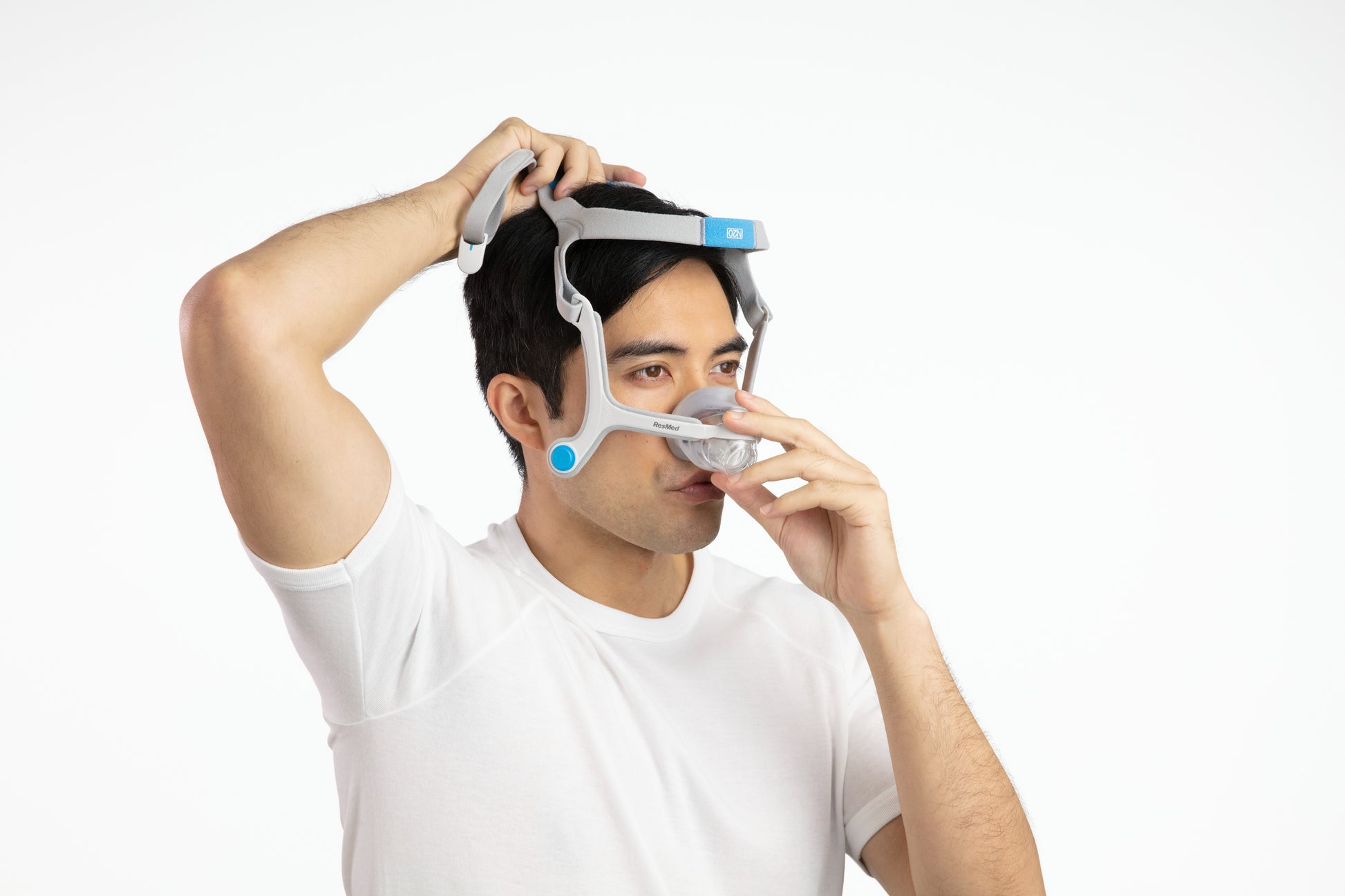A man fitting the AirTouch N20 Nasal CPAP Mask